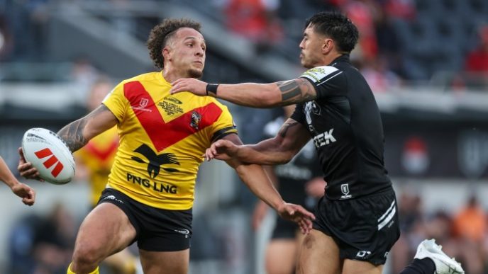 Liam Horne of Papua New Guinea’s national team is tackled by a New Zealand Kiwis player during the Men's Pacific Championships promotion/relegation playoff match at CommBank Stadium in Sydney in November