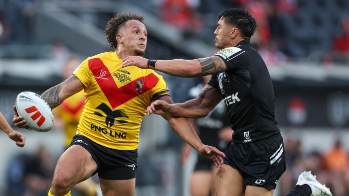 Liam Horne of Papua New Guinea’s national team is tackled by a New Zealand Kiwis player during the Men's Pacific Championships promotion/relegation playoff match at CommBank Stadium in Sydney in November