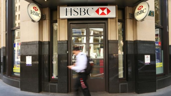 A pedestrian walks past an HSBC bank branch in Sydney