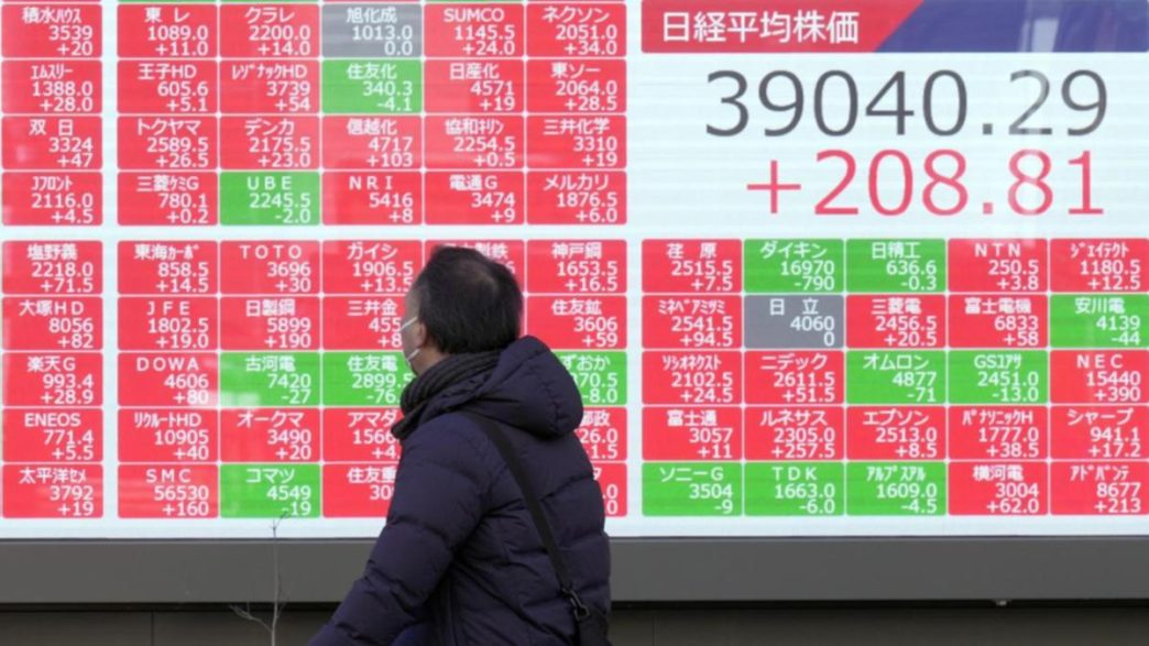 Asian shares slide amid worries about US curbs on