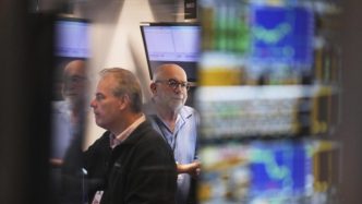 Wall Street wavers after weak consumer confidence